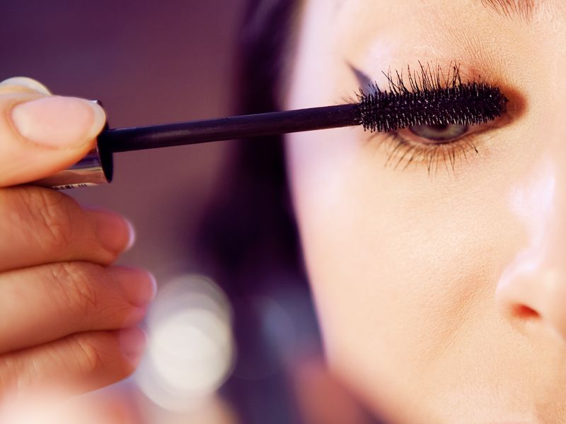 Mascara wand on lashes
