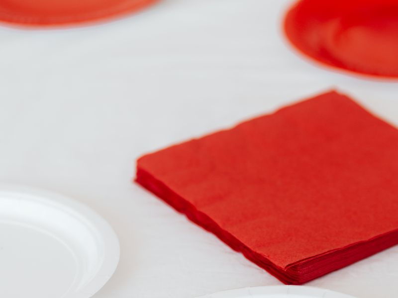 White paper plates and red napkins