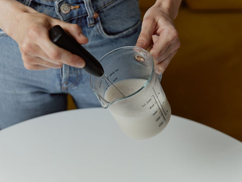 Frothing milk in a measuring cup