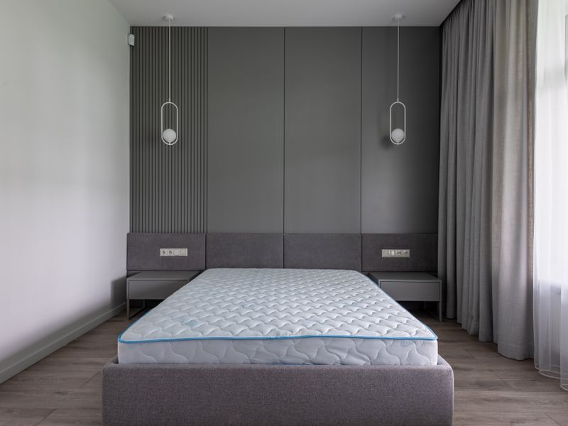 Bare mattress on a bed frame