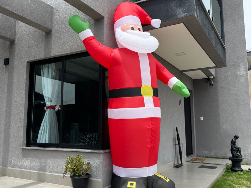 Giant inflatable Christmas yard decoration outside a house